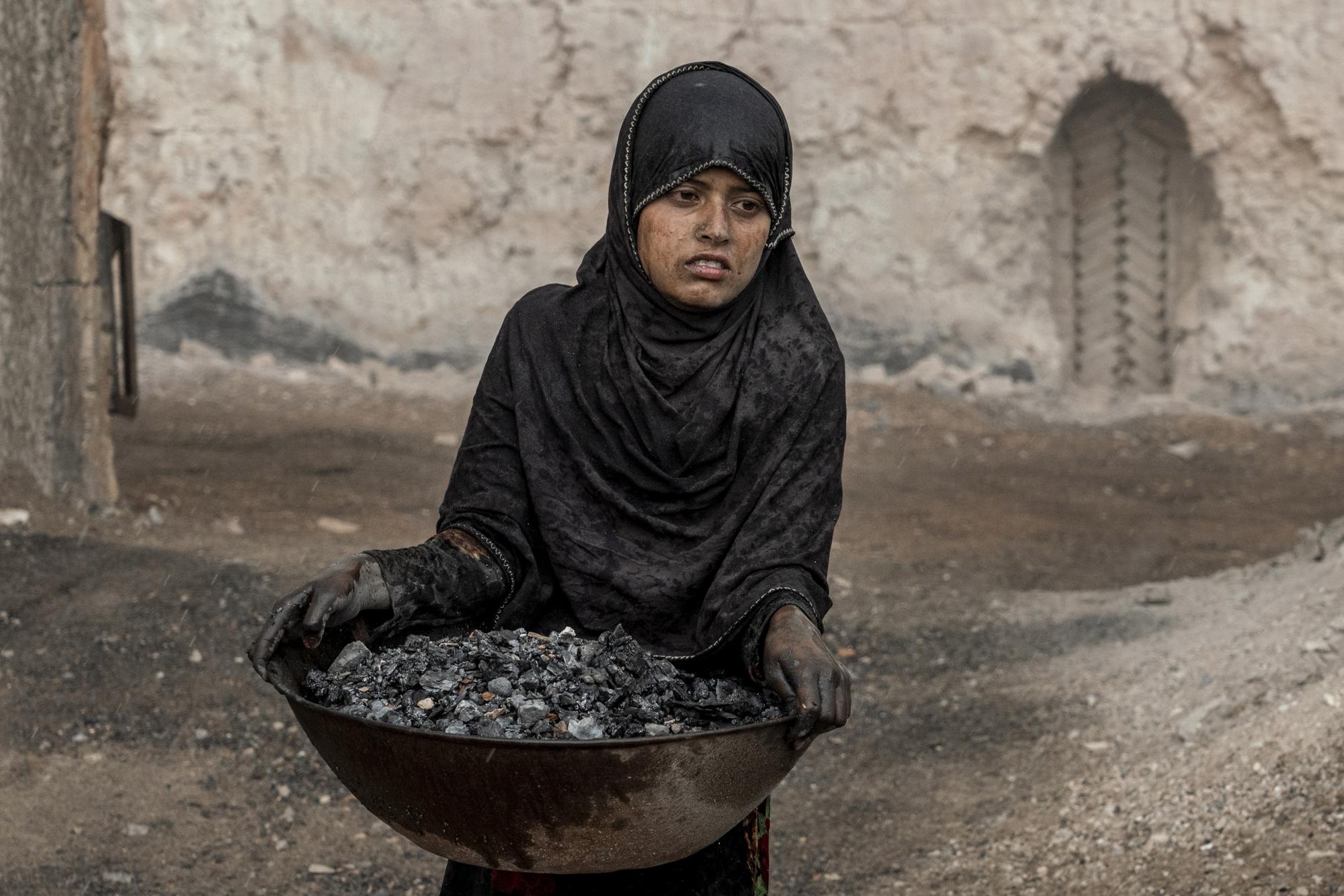 11. A 9-year-old girl works in a brick factory on the outskirts of Kabul, Afghanistan, on Aug. 20, 2022. Aid agencies say the number of children working in Afghanistan is growing ever since the economy collapsed following the Taliban takeover
more than a year ago.