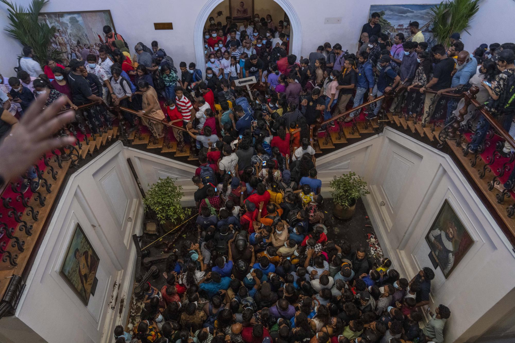 4. People throng President Gotabaya Rajapaksa's official residence in Colombo, Sri Lanka, on July 11, 2022, the day after it was stormed by protesters demanding his resignation amid the country's worst economic crisis in recent memory.